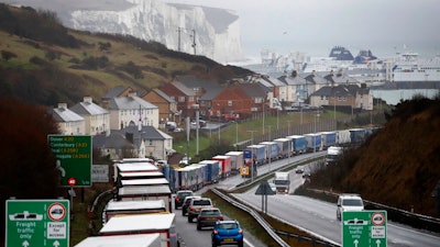 Lorries queue on the approaches to Dover, England, Friday, Dec. 11, 2020. The U.K. left the EU on Jan. 31, but remains within the bloc's tariff-free single market and customs union until the end of the year. British Prime Minister Boris Johnson says there is a 'strong possibility' that talks on a post-Brexit trade agreement with the EU will end without agreement.