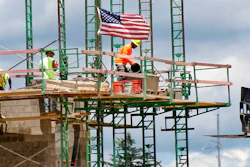 In this June 11, 2020 file photo, workers on scaffolding lay blocks on one of the larger buildings at a development site where various residential units and commercial sites are under construction in Cranberry Township, Butler County, Pa. U.S. productivity increased at a solid 4.6% pace in the July-September quarter, slightly below the initial estimate, while labor costs fell at a slower pace. The Labor Department reported that the third quarter increase in productivity was below the first estimate a month ago of a 4.9% increase.