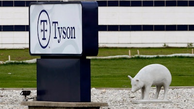 In this May 1, 2020, file photo, a sign sits in front of the Tyson Foods plant in Waterloo, Iowa. The coronavirus devastated the nation's meatpacking communities in Iowa, Nebraska, and Minnesota earlier in the year. Behemoths like Walmart and Tyson, which have been the target of COVID-19-related lawsuits, can largely absorb any losses. But hundreds of negligence lawsuits have been filed across the country, with mom-and-pops most fearing the prospect of litigation that could put them under.