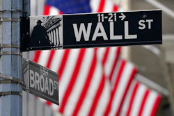In this Nov. 23, 2020, photo, a street sign is displayed at the New York Stock Exchange in New York. S&P DJ Indices is removing 21 Chinese companies from its indexes, or groups of stocks and bonds used to track financial market movements, after Americans were barred from investing in them as part of a feud with Beijing over technology and security.