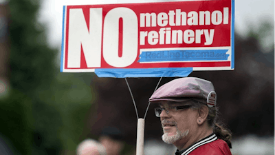 Mark Keely of Kalama, Wash., stands with other protesters outside the Washington Department of Ecology's Vancouver field office in 2017.