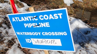 Signs that mark the route of the Atlantic Coast Pipeline in Deerfield, Va.