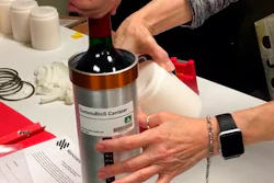 Researchers prepare bottles of French red wine to be flown from Wallops Island, Va., to the International Space Station, Nov. 2, 2019.