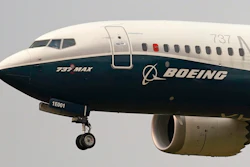 In this Sept. 30, 202, file photo, a Boeing 737 Max jet, piloted by Federal Aviation Administration (FAA) chief Steve Dickson, prepares to land at Boeing Field following a test flight in Seattle.