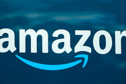 In this Oct. 1, 2020 file photo, an Amazon logo appears on an Amazon delivery van in Boston. Amazon continues to grow, with plans to add more than 3,000 jobs in Boston over the next several years. The company said Tuesday, Jan. 26, 2021, that expansion plans for its Boston Tech Hub will bring new jobs for units including Alexa, Amazon Web Services, Amazon Robotics, and Amazon Pharmacy.