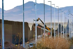 Crews construct a section of border wall in San Bernardino National Wildlife Refuge. The order leaves projects across the border unfinished and under contract.