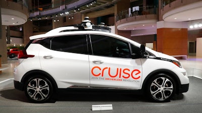 In this Jan. 16, 2019, file photo, Cruise AV, General Motor's autonomous electric Bolt EV is displayed in Detroit. General Motors' self-driving car company is sending vehicles without anybody behind the wheel in San Francisco as it navigates its way toward launching a robotic taxi service that would compete against Uber and Lyft in the hometown of the leading ride-hailing services. The move announced Wednesday, Dec. 9, 2020, by GM-owned Cruise come two months after the company received California’s permission to fully driverless cars in the state.