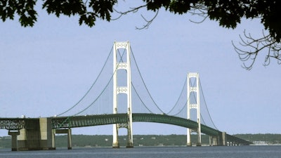 This July 19, 2002, file photo, shows the Mackinac Bridge that spans the Straits of Mackinac from Mackinaw City, Mich. Michigan's environmental agency said Friday, Jan. 29, 2021, it had approved construction of an underground tunnel to house a replacement for a controversial oil pipeline in a channel linking two of the Great Lakes.