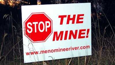 This Oct. 20, 2008 file photo shows, one of many signs that have popped up in yards, on trees and along roads in the Lake Township, Mich., section of Menominee County, where the proposed Aquila Resources Inc. mine would be located. Administrative Law Judge Daniel Pulter has overruled state regulators who granted a permit required for construction of the open-pit mine in the Upper Peninsula, in a decision released Monday. Jan. 4, 2021, creating another delay for a project that has been debated for nearly two decades.