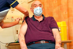 82-year-old Brian Pinker receives the Oxford University/AstraZeneca COVID-19 vaccine from nurse Sam Foster at the Churchill Hospital in Oxford, England, Monday, Jan. 4, 2021. Pinker, a retired maintenance manager received the first injection of the new vaccine developed by between Oxford University and drug giant AstraZeneca.