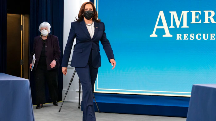Vice President Kamala Harris, right, and Treasury Secretary Janet Yellen, arrive to attend a virtual roundtable with participants from Black Chambers of Commerce across the country to discuss the American Rescue Plan, Friday, Feb. 5, 2021, at the South Court Auditorium on the White House complex in Washington.