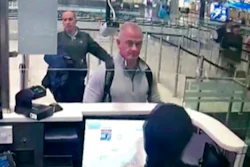 Image from security camera video showing Michael L. Taylor, center, and George-Antoine Zayek at passport control, Istanbul Airport, Dec. 30, 2019.