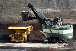 A mechanized shovel loads a haul truck with coal at the Spring Creek coal mine near Decker, Mont., April 4, 2013.