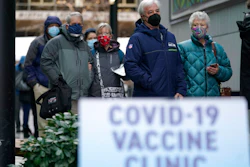 People waiting to receive the first dose of a Pfizer vaccine in Seattle, Jan. 24, 2021.