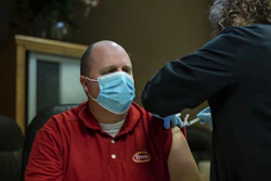 In this Feb. 2 photo, Tyson Foods team members receive Covid-19 vaccines from health officials at the Wilkesboro, NC facility.