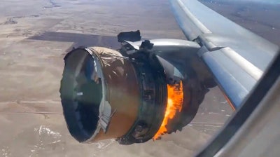 In this image taken from video, the engine of United Airlines Flight 328 is on fire after after experiencing 'a right-engine failure' shortly after takeoff from Denver International Airport, Saturday, Feb. 20, 2021, in Denver, Colo. The Boeing 777 landed safely and none of the passengers or crew onboard were hurt.