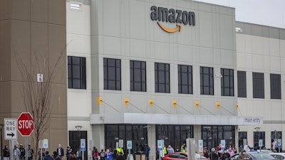 In this file photo, workers at Amazon's fulfillment center in Staten Island, N.Y., gather outside to protest work conditions.