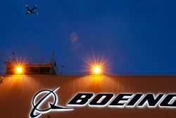 In this Oct. 19, 2015, file photo, an airplane flies over a sign at Boeing's newly expanded 737 delivery center at Boeing Field in Seattle. Federal regulators have imposed $5.4 million in civil penalties against Boeing on Thursday, Feb. 25, 2021, for violating terms of a $12 million settlement in 2015, and the aircraft maker has agreed to pay another $1.21 million to settle two current enforcement cases.