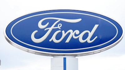 In this Sunday, Dec. 20, 2020, file photo, the company logo is viewed on a sign outside a Ford dealership, in Centennial, Colo. Ford has lost track of some older Takata air bags that can explode and hurl shrapnel, so it's recalling more than 154,000 vehicles in North America to check for them. The company on Thursday, Feb. 18, 2021, issued two recalls, with the largest coming because Ford can't find 45 obsolete air bags that may have been installed on some old Ranger pickup trucks.