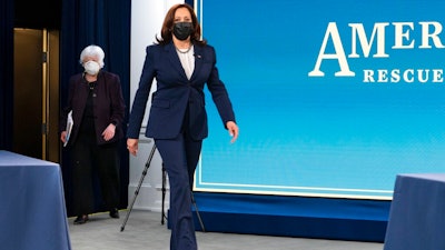 Vice President Kamala Harris, right, and Treasury Secretary Janet Yellen, arrive to attend a virtual roundtable with participants from Black Chambers of Commerce across the country to discuss the American Rescue Plan, Friday, Feb. 5, 2021, at the South Court Auditorium on the White House complex in Washington.