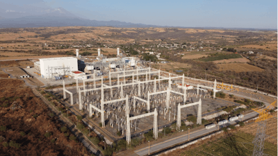In this file photo, a newly built power generation plant that is part of a mega-energy project including a natural gas pipeline traversing three states is seen with the Popocatepetl Volcano in the background near Huexca, Morelos state, Mexico.