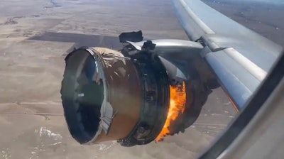 In this image taken from video, the engine of United Airlines Flight 328 is on fire after after experiencing a 'right-engine failure' shortly after takeoff from Denver International Airport, Saturday, February 20, 2021.