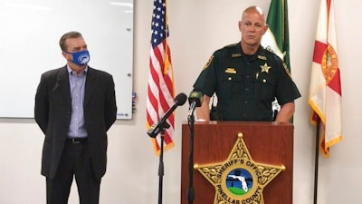 In this screen shot from a YouTube video posted by the Pinellas County Sheriff's Office, Pinellas County Sheriff Bob Gualtieri speaks during a news conference as Oldsmar, Fla., Mayor Eric Seidel, left, listens, Monday, Feb. 8, 2021, in Oldsmar, Fla. Authorities say a hacker gained access to Oldsmar's water treatment plant in an unsuccessful attempt to taint the water supply with a caustic chemical.