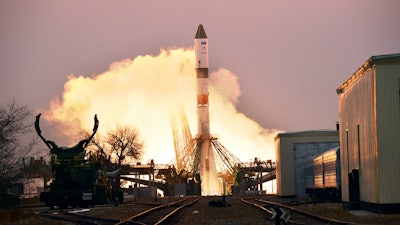 In this photo provided by Roscosmos Space Agency Press Service, the Progress MS-16 cargo blasts off from the launch pad at Russia's space facility.