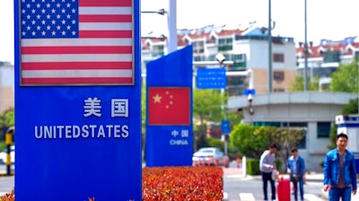 Display boards featuring the U.S. and Chinese flags in a special trade zone in Qingdao, China, May 8, 2019.
