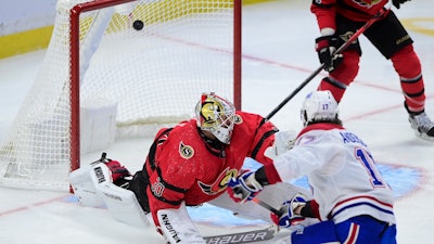 Montreal Canadiens right wing Josh Anderson (17) blasts the puck past Ottawa Senators goaltender Matt Murray (30) during the third period of an NHL hockey game in Ottawa on Saturday, Feb. 6, 2021.