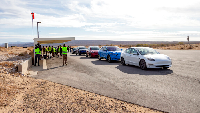 Five electric vehicles at a test track in California's Mojave Desert.