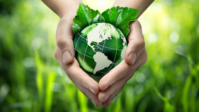 Hands Holding Green Globe With Grassy Background 453897319 1987x1512 1 6048d8f724bf3