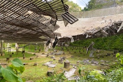 A 100-foot gash, created by a broken cable and metal platform, in the radio telescope's reflector dish in Arecibo, Puerto Rico, Aug. 11, 2020.