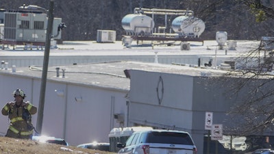 A Hall County firefighter leaves following a liquid nitrogen leak that killed six people at Prime Pak Foods, a poultry plant, on Jan. 28 in Gainesville, GA.