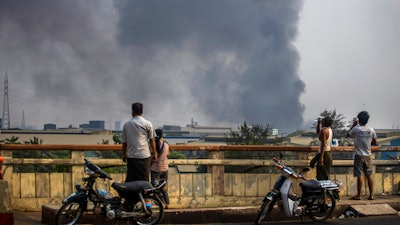 Smoke billows from the industrial zone of Hlaing Thar Yar township, Yangon, Myanmar, March 14, 2021.