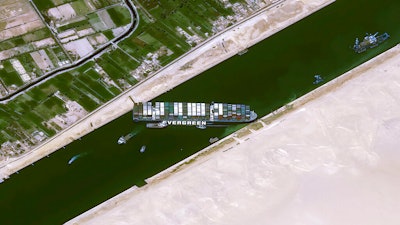 This satellite image from Cnes2021, Distribution Airbus DS, shows the cargo ship MV Ever Given stuck in the Suez Canal near Suez, Egypt on March 25.