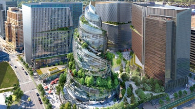 This artist rendering provided by Amazon shows the next phase of the company's headquarters redevelopment to be built in Arlington, Va. The plans released Tuesday, Feb. 2, 2021, features a 350-foot helix-shaped office tower that can be climbed from the outside like a mountain hike. Amazon is making its first foray into providing health care services, announcing Wednesday, March 17, 2021, that it will be offering its Amazon Care telemedicine program to employers nationwide.