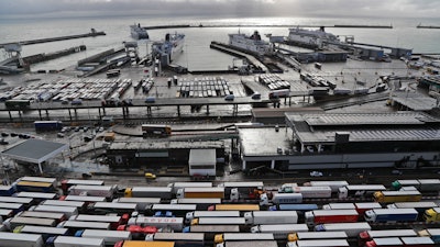 In this file photo, lorries queue at Check-in at the port in Dover, Britain, before entering the EU.