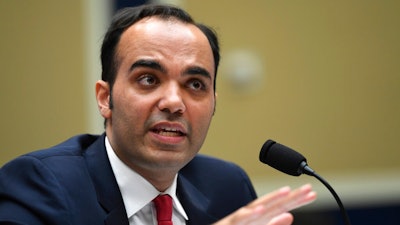In this May 8, 2019 file photo, then Federal Trade Commission commissioner Rohit Chopra testifies during a House Energy and Commerce subcommittee hearing on Capitol Hill in Washington. Chopra, President Joe Biden’s nominee to run the federal consumer watchdog agency is likely to be face hostile questioning from Republican Senators on Tuesday, March 2, 2021, but is likely to be confirmed with Democrats controlling a majority in the Senate.