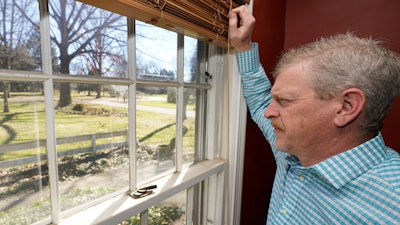 GM autoworker Matt Moorhead looks out his window in Warren, Ohio.