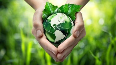Hands Holding Green Globe With Grassy Background 453897319 1987x1512 1 6048d8f724bf3