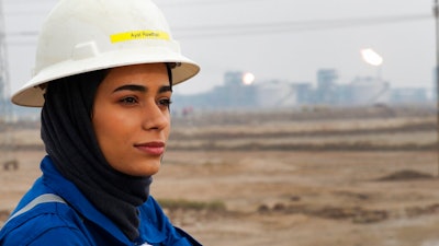 Ayat Rawthan, a petrochemical engineer, poses for a photo near an oil field outside Basra, Iraq, Tuesday, Feb. 5, 2021. Rawthan is among just a handful of women who have eschewed the dreary office jobs typically handed to female petrochemical engineers in Iraq. Instead, they chose to become trailblazers in the country’s oil industry, taking up the grueling work of drilling.