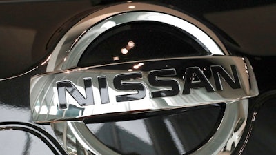In this Feb. 9, 2017 file photo, the logo of the Nissan Motor Co. is seen on a car displayed at the gallery of its global headquarters in Yokohama, near Tokyo. Nissan is recalling more than 854,000 cars in the U.S. and Canada because the brake lights might not come on when the driver presses on the pedal. The recall covers certain Sentra compacts from the 2016 through 2019 model years, including more than 807,000 in the U.S.