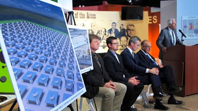 In this April 29, 2015, file photo, an illustration depicts a planned interim storage facility for spent nuclear fuel in southeastern New Mexico as officials announce plans to pursue a project by Holtec International during a news conference at the National Museum of Nuclear Science and History in Albuquerque, N.M. On Monday, March 29, 2021, New Mexico sued the U.S. Nuclear Regulatory Commission over concerns that the federal agency hasn't done enough to vet plans for a multibillion-dollar facility to store spent nuclear fuel in the state. New Jersey-based Holtec International wants to build a complex in southeastern New Mexico where tons of spent fuel from commercial nuclear power plants around the nation could be stored until the federal government finds a permanent solution.