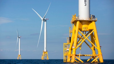 In this Monday, Aug. 15, 2016, file photo, three of Deepwater Wind's turbines stand in the water off Block Island, R.I. A huge wind farm off the Massachusetts coast is edging closer to federal approval, setting up what the Biden administration hopes will be a model for a sharp increase in offshore wind energy development along the East Coast.