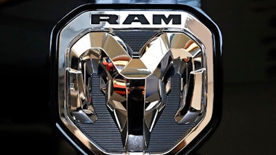 This Feb. 13, 2020 photo shows the Ram truck logo at the 2020 Pittsburgh International Auto Show in Pittsburgh. The company that makes heavy-duty diesel Ram trucks is telling some owners to park them outdoors due to the risk of an engine fire. Fiat Chrysler, now part of Stellantis, is recalling just over 20,000 of the trucks mainly in the U.S. and Canada.