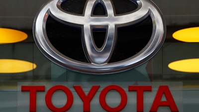 The Toyota logo is displayed at their shop on the Champs Elysees Avenue in Paris.