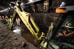 Amtrak workers perform tunnel repairs to a partially flooded train track bed, Saturday, March 20, 2021, in Weehawken, N.J.