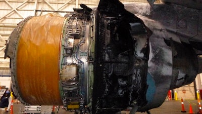 This photo provided by The National Transportation Safety Board shows the damaged engine of United Airlines Flight 328. Federal safety officials are updating their investigation into the engine failure on the United Airlines plane that sent parts of the engine housing raining down on Denver-area neighborhoods last month. The National Transportation Safety Board said Friday, March 5, 2021 that a microscopic exam confirmed that a fan blade that snapped off had telltale signs of fatigue — tiny cracks caused by wear and tear.