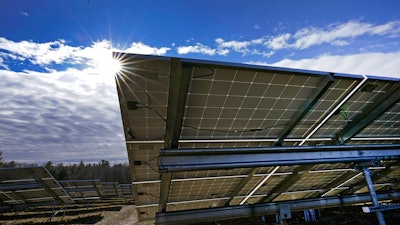Solar panels face the sun on Burrillville, R.I., at ISM Solar's 10-acre solar farm.